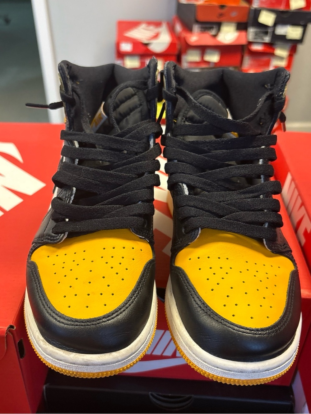 Nike Air Jordan 1 Retro High OG "Yellow Toe" sneakers, also known as "Taxi 7y